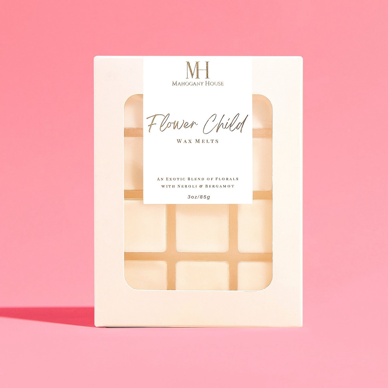 Flower Child Wax Melts by Mahogany House on a bright pink background, showcasing the front label with a clean floral design.