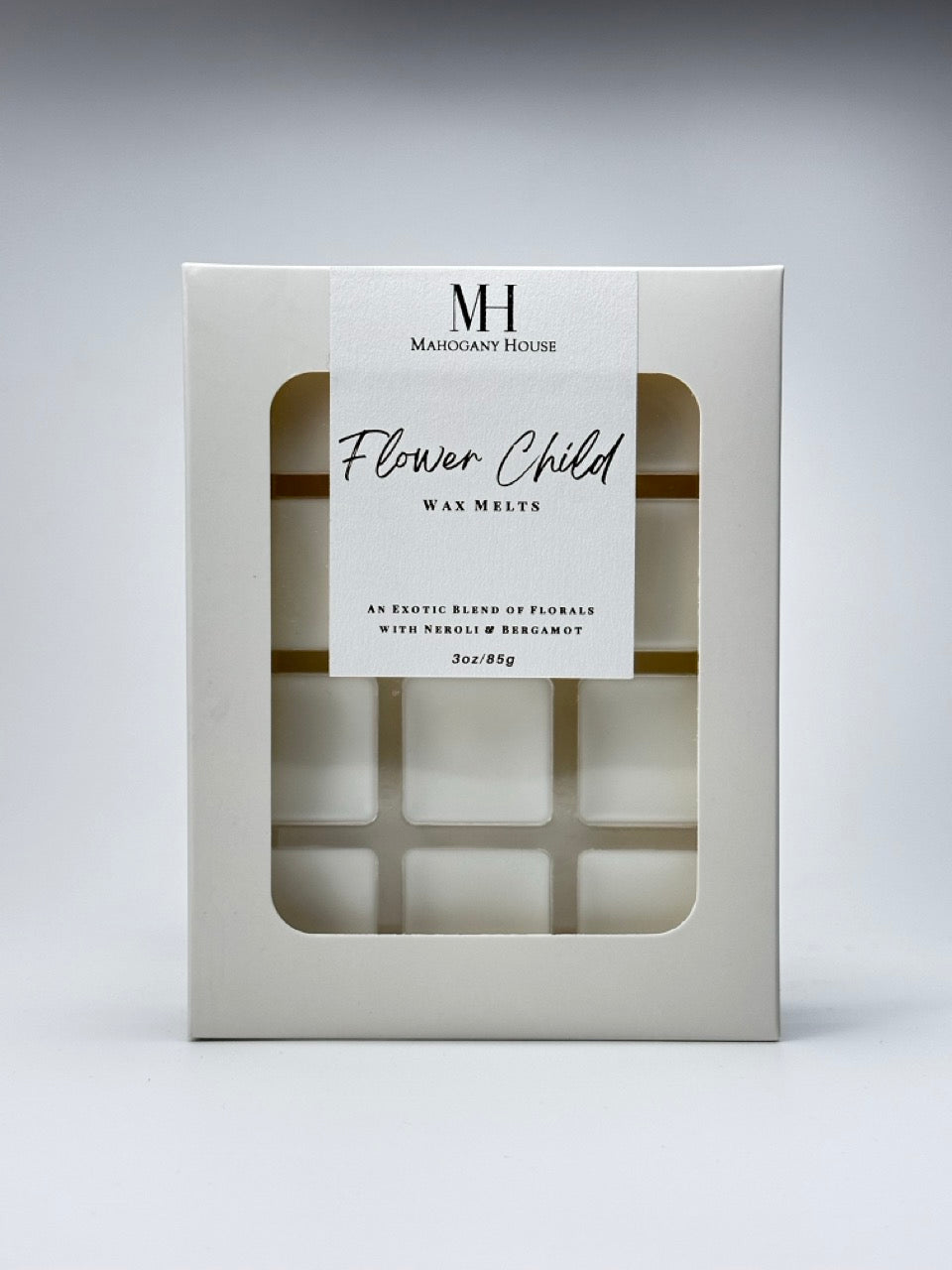 Flower Child Wax Melts photographed against a neutral white background, showing the packaging with visible wax squares.