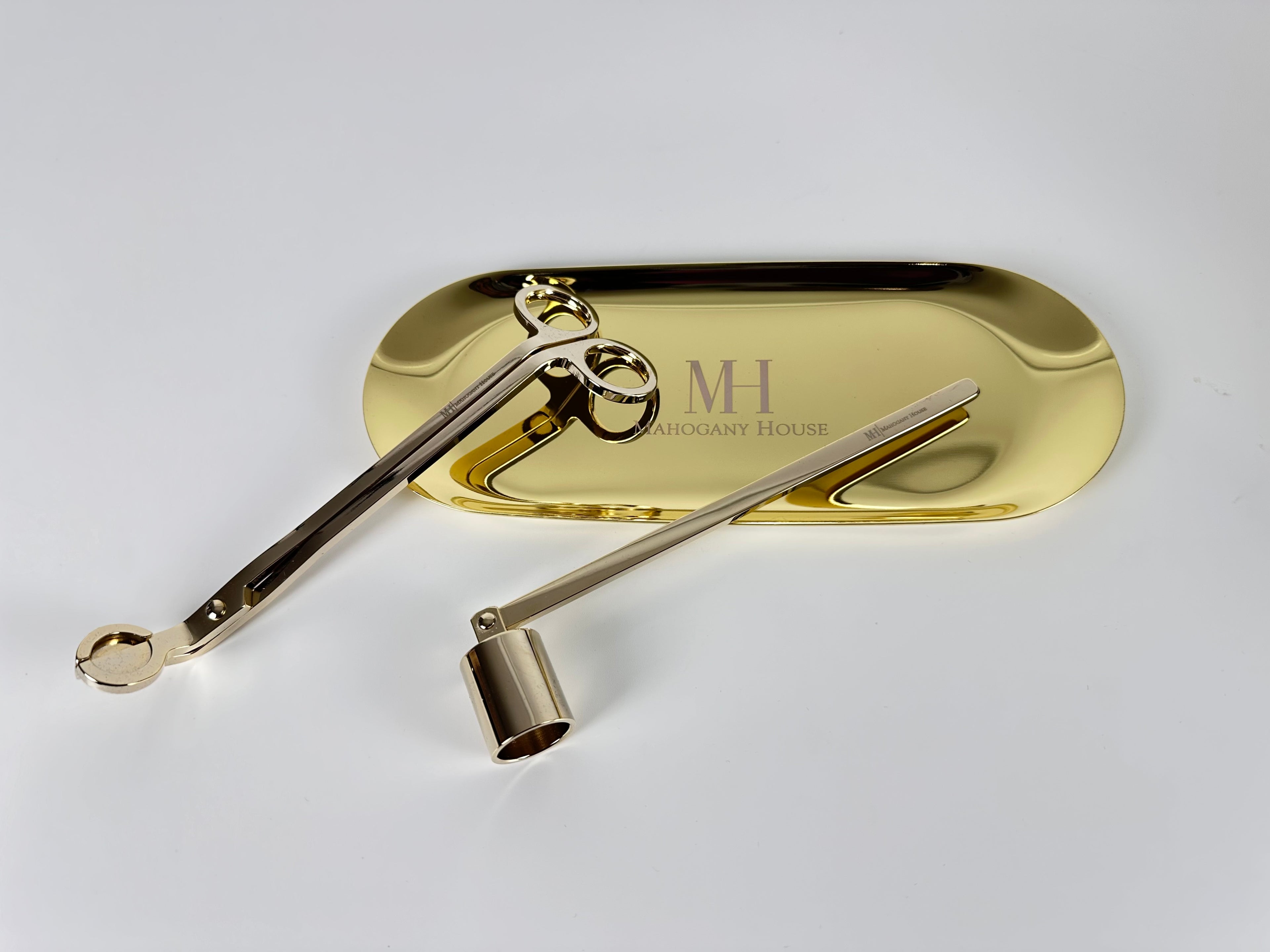 Gold candle care kit with snuffer, wick trimmer, and holder plate