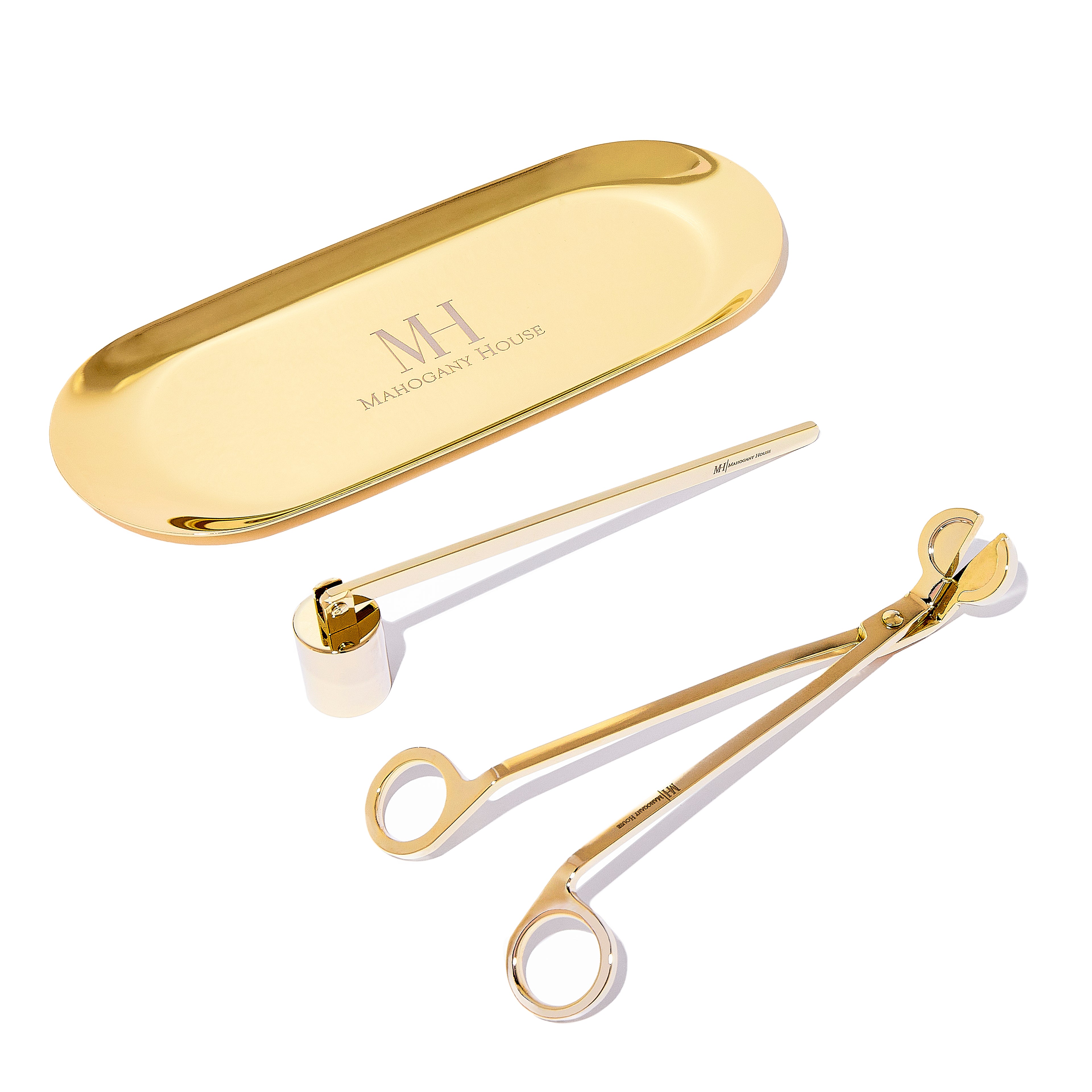 Gold candle care kit with snuffer, wick trimmer, and holder plate