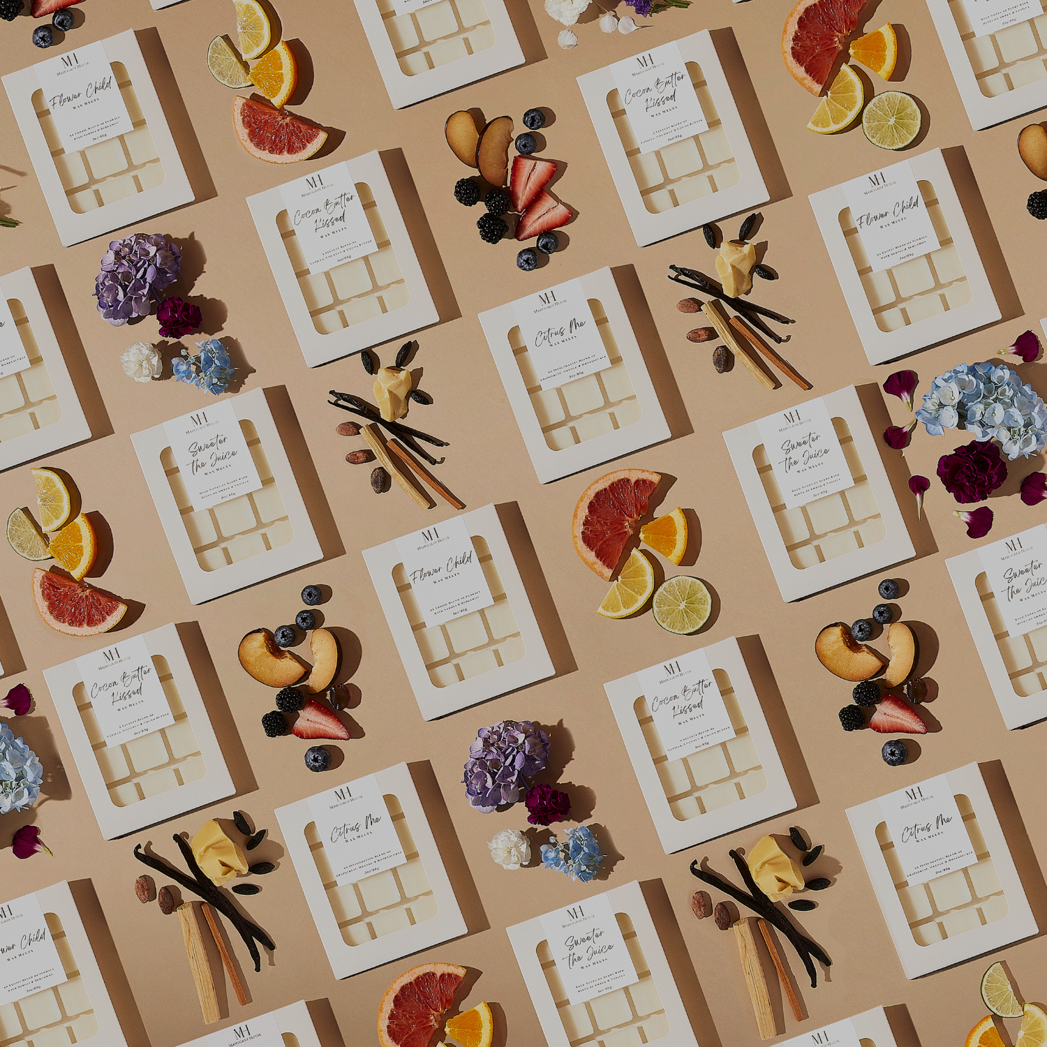 Flat lay of Mahogany House wax melt collection, showcasing various luxurious scents like Flower Child, Sweeter the Juice, and Citrus Me. Each hand-poured wax melt is crafted with premium ingredients and designed to provide long-lasting fragrance for your home.