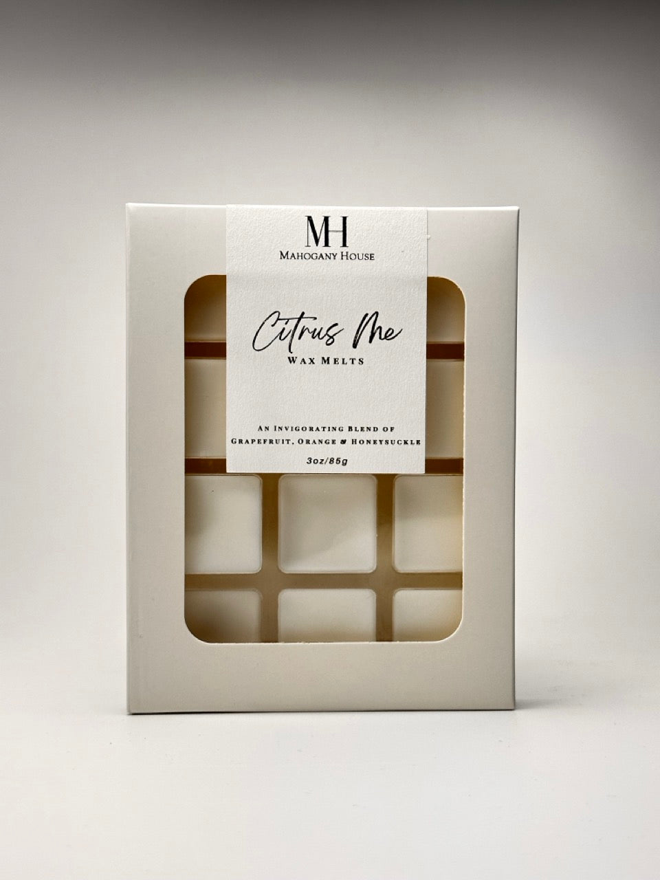 Mahogany House Citrus Me Wax Melts photographed on a clean white background, showing the front label and wax cube details.