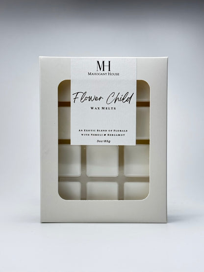 Flower Child Wax Melts photographed against a neutral white background, showing the packaging with visible wax squares.