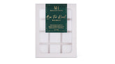 Mahogany House Be Fir Real wax melts with balsam fir, cedar, and juniper in green holiday packaging on white background.
