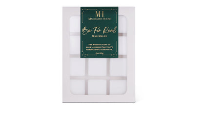 Mahogany House Be Fir Real wax melts with balsam fir, cedar, and juniper in green holiday packaging on white background.