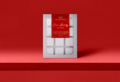 Mahogany House Cran-Merry wax melts with cranberry, mandarin and rosemary and juniper in green holiday packaging.