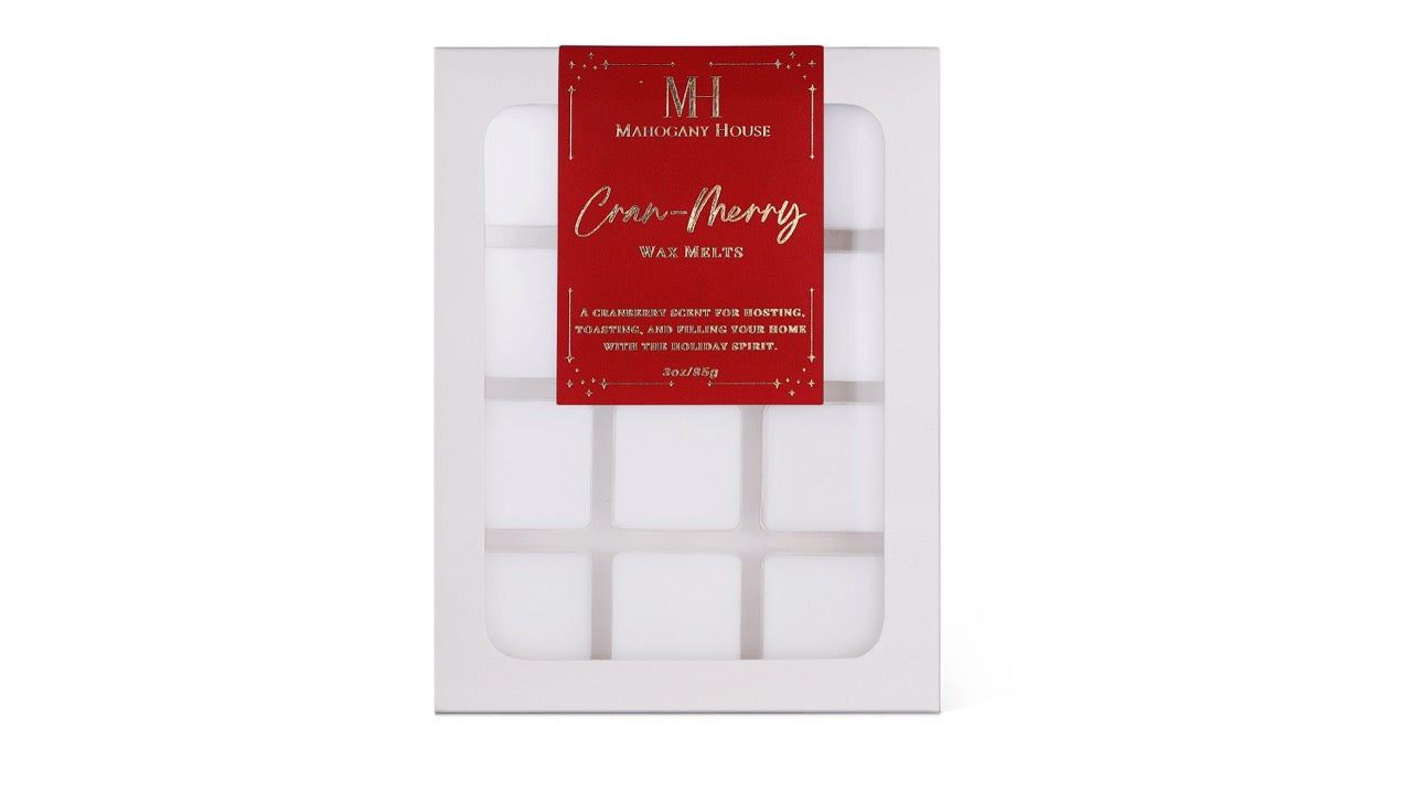 Mahogany House Cran-Merry wax melts with cranberry, mandarin and rosemary and juniper in green holiday packaging.