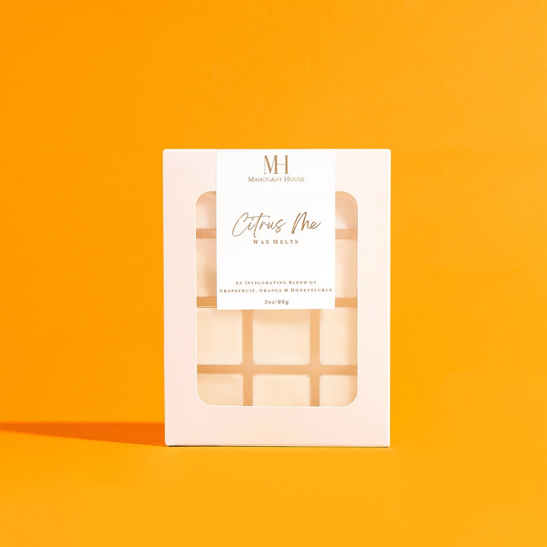 orange.jpg
Citrus Me Wax Melts by Mahogany House displayed at an angle against an orange backdrop, emphasizing the fresh citrus design.