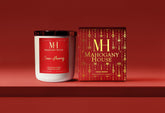 Mahogany House candle and packaging on a red background