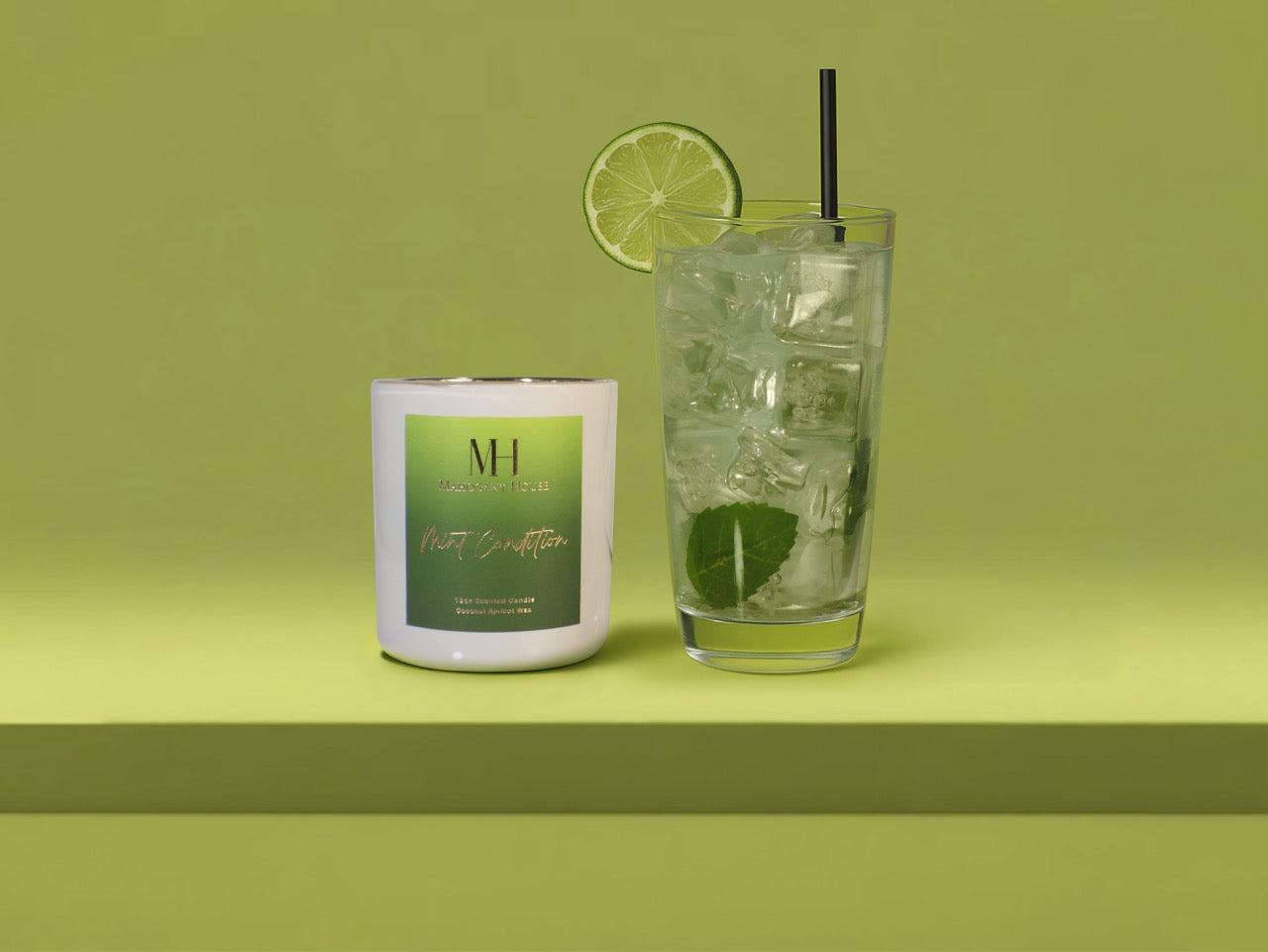 Mint Condition 10oz wooden wick candle styled with a cocktail glass, fresh lime garnish, and mint sprig on a green background.