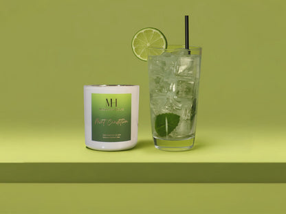 Mint Condition 10oz wooden wick candle styled with a cocktail glass, fresh lime garnish, and mint sprig on a green background.