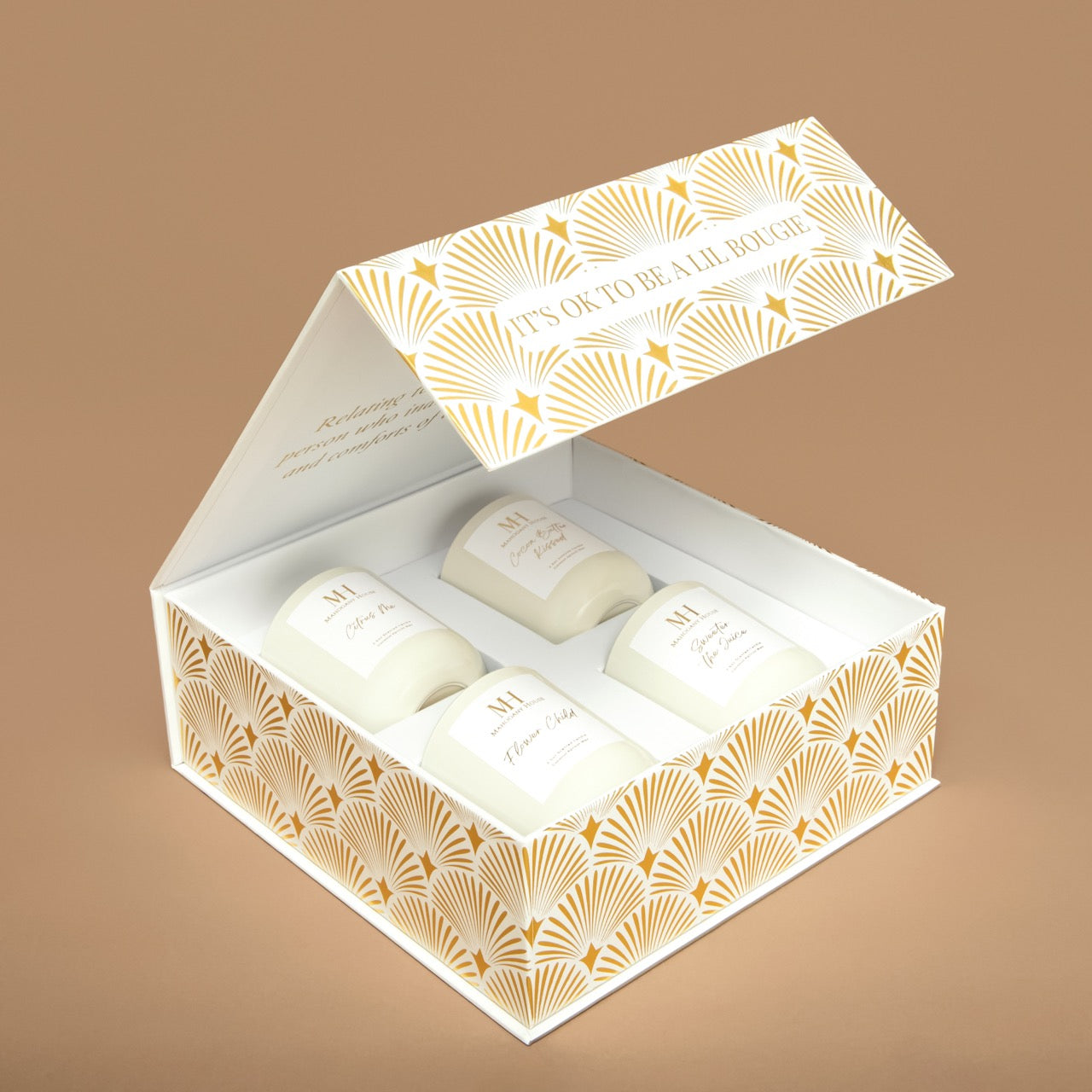 Close-up side angle of Mahogany House Votive Candles neatly arranged inside the white magnetic-close gift box.