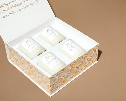 Close-up of Mahogany House votive candles neatly arranged inside the white magnetic-close gift box with lid open.